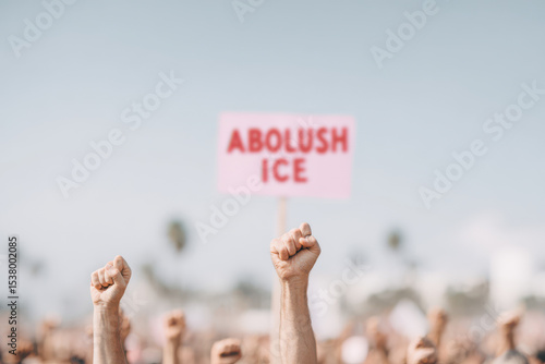powerful scene of protesters holding abolish ice signs on blocked road