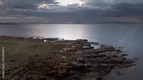 Aerial footage of Kelvedon Beach, Tasmania at sunrise. Captured after a night storm, the video shows moody skies, soft light, and serene coastal beauty in 4K.