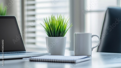 Wallpaper Mural Modern workspace with laptop, plant, and coffee cup Torontodigital.ca