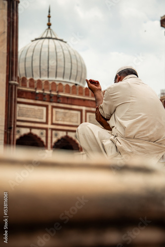 Photography Muslim devotee praying in Jama Masjid mosque in Delhi, India