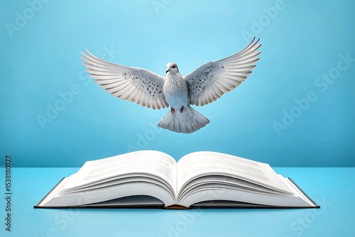 White dove soaring above an open book