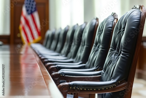  Empty jury seats near US flag, solemn scene focused on justice, lighting highlights chair and flag on white background, symbolic of law and order.