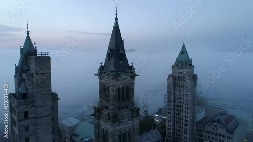 Wallpaper Mural Aerial View of Historic Towering City Buildings Shrouded in Fog During Dawn with Slow Camera Movement Torontodigital.ca
