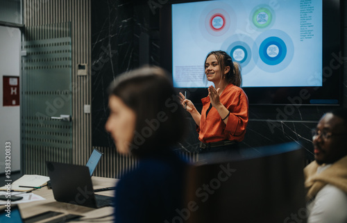 Business people strategizing in a modern office. They are focused on analyzing data and generating solutions for growth, fostering collaboration and innovative ideas late into the night.