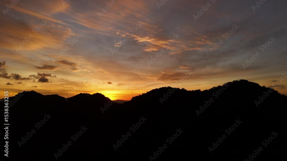 breathtaking sunset over the ocean, painting the sky in vibrant orange, red, and purple hues above the silhouette of coastal buildings and anchored ships. Peaceful and cinematic breathtaking sunset over the ocean, painting the sky in vibrant orange, red, and purple hues above the silhouette of coastal buildings and anchored ships. Peaceful and cinematic