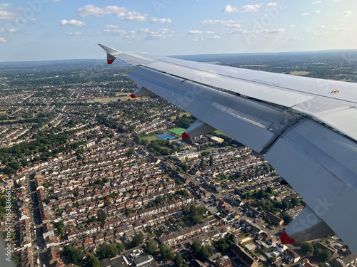 Flying over London on approach to Heathrow airport , UK