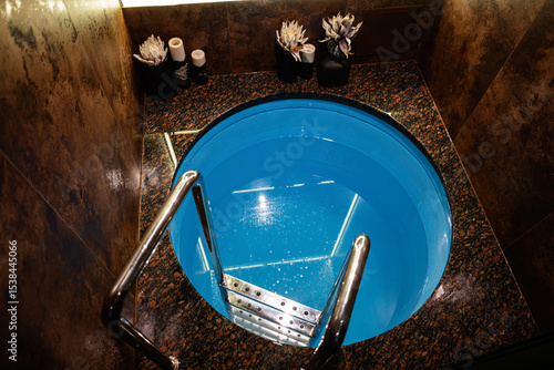 Canvas Print Elegant indoor plunge pool with granite surroundings and modern design