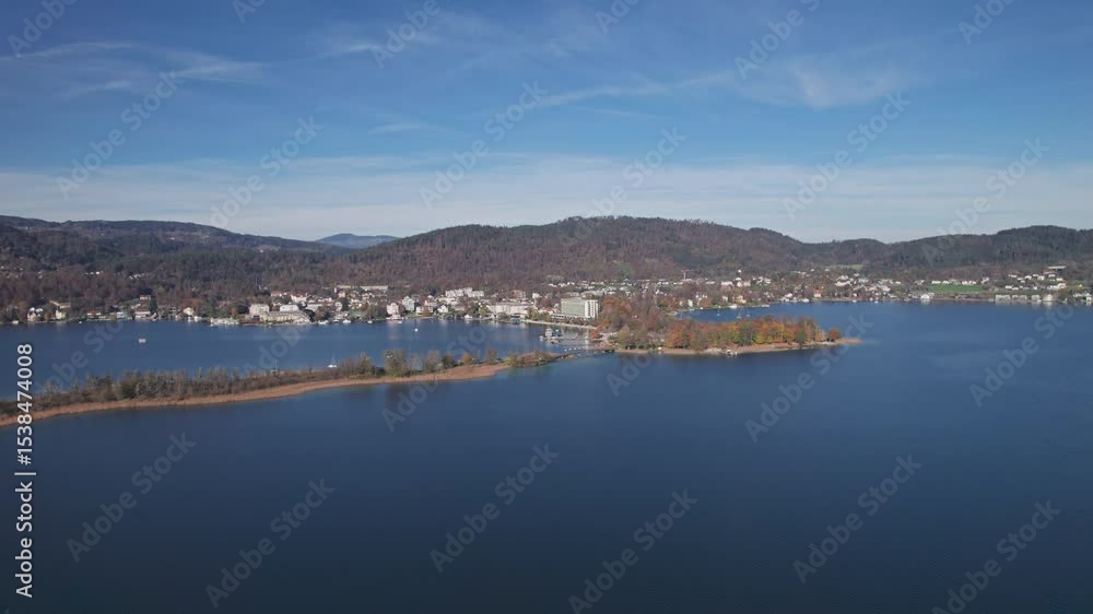 Flight over of Lake Worthersee and Portschach am Worther See at autumn, in Carinthia, Austria. 2x speeded up from 30 fps. Flight over of Lake Worthersee and Portschach am Worther See at autumn, in Carinthia, Austria. 2x speeded up from 30 fps.