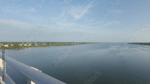 Wallpaper Mural Smooth tracking shot along a bridge over open water, ending in a wide horizon. Perfect for scenic transportation, infrastructure, or oceanfront b-roll. Torontodigital.ca
