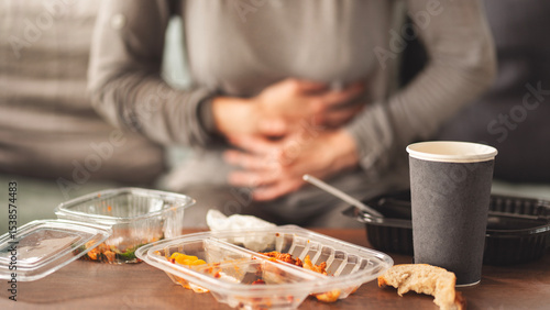 Canvas Print Woman with bloating and stomach pain after fast food meal