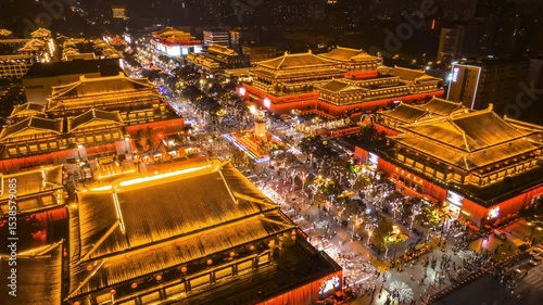 Xian Datang Nocturnal City aerial view at night showcases vibrant culture and bustling city attractions