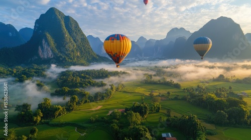 flying hot air balloon over river at Vang Vieng, Laos. 