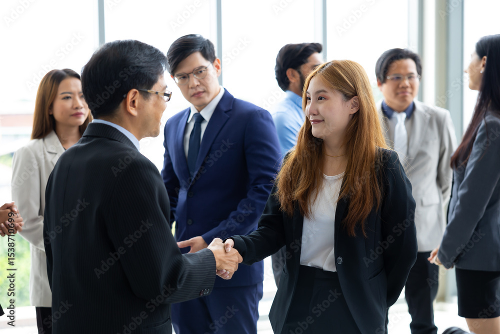 business woman shaking hands on business cooperation agreement. Successful Asian business women handshaking after good deal. successful negotiate, hand shake celebration partnership and business deal business woman shaking hands on business cooperation agreement. Successful Asian business women handshaking after good deal. successful negotiate, hand shake celebration partnership and business deal