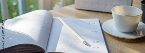 Calendar book for Planner to plan reminder daily appointment timetable, appointment, organization, and meeting agenda of job on wooden desk, work from home-banner image.
