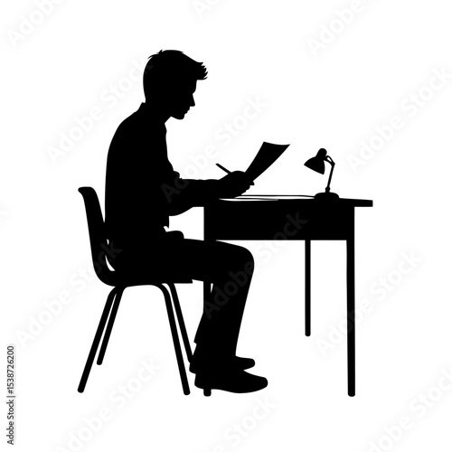 Silhouette Of Student Studying At Desk Concentrated And Focused On Their Work