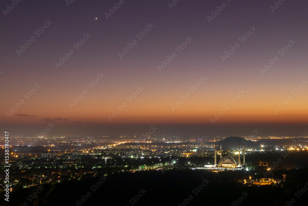 Fototapeta premium The Faisal Mosque is the national mosque of Pakistan in magic sunset time, located in the capital city, Islamabad. It is the fifth-largest mosque in the world.