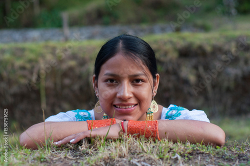 Smiling indigenous woman wearing traditional clothes and jewelry