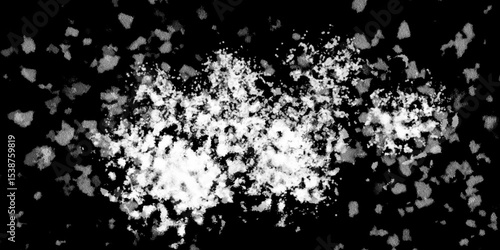 Snowflakes on dark background. white icy snowflakes isolated on black background, natural background. white crystalline powder on a black background. sugar dust. texture, pattern and clipping.