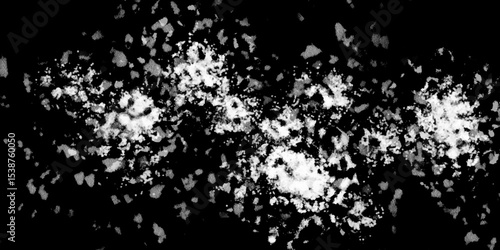 Snowflakes on dark background. white icy snowflakes isolated on black background, natural background. white crystalline powder on a black background. sugar dust. texture, pattern and clipping.
