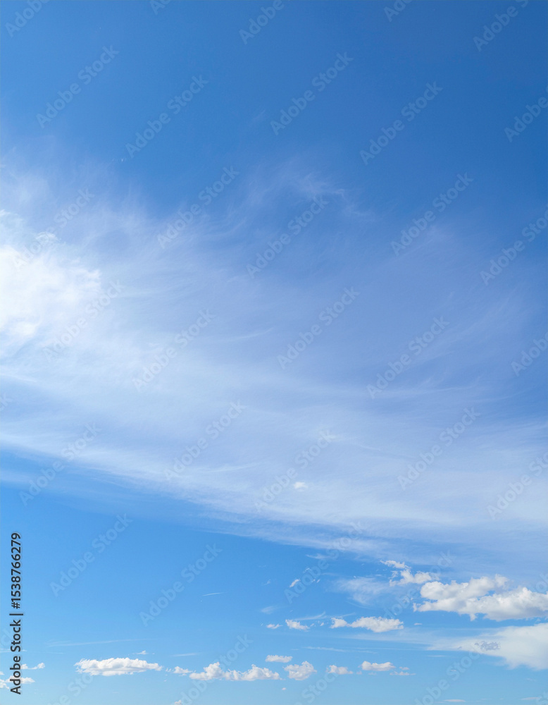 Fototapeta premium blue sky with light scattered white clouds