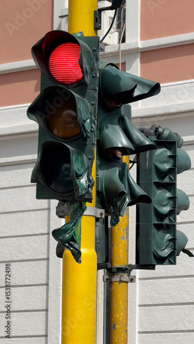 Melted Traffic Light in Extreme Summer Heat on Urban Street Pole