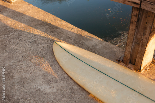 Photography Beige surfboard in the sun