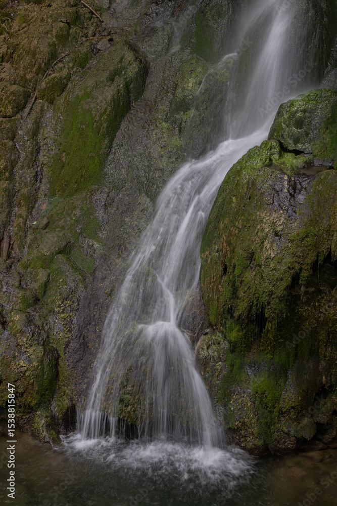 Fototapeta premium Long exposure shot of a waterfall in the forest.