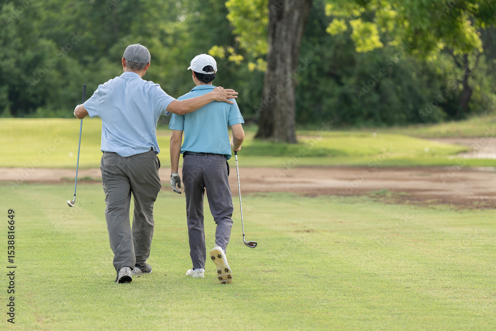 Fototapeta premium Good shot buddy. Shot of two happy men playing a game of golf. Golf, friends and sport with men on course playing