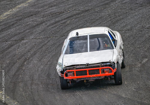 2025-06-14 A WHITE RACE CAR WITH A ORANGE BUMBER ENTERING A CORNER AT THE RACE TRACK AT THE EVERGREEN STATE FAIRGROUNDS IN MONROE WASHINGTON