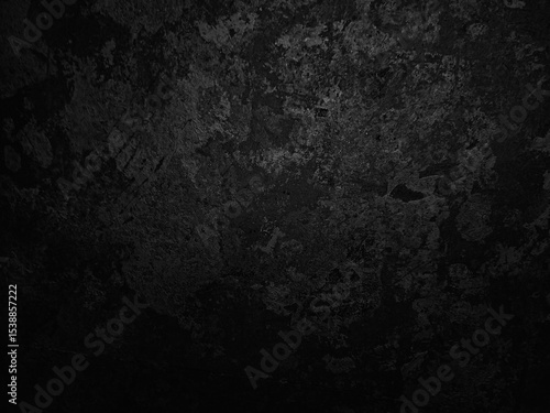 Dark textured surface with abstract patterns, featuring a mix of rough and smooth areas. The intricate details create a sense of depth and complexity, resembling a mysterious landscape
