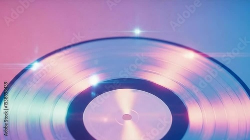 Close up of a retro vinyl record with blue and pink light flares. Music concept for vintage sound. Record player for old songs