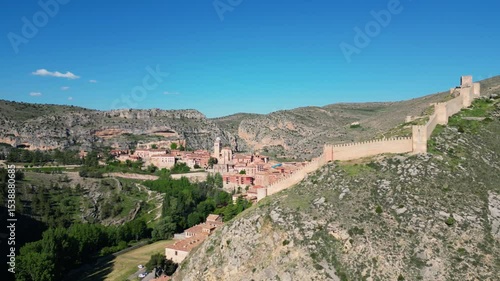 Albarracín ialongside the Guadalaviar River in Spain. A 35 second aerial approach towards this ancient, beautiful spanish town