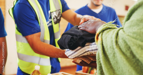 Fotografie Clothes, help or hands with donation for homeless person, social project or community relief