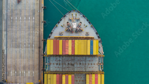 Top view Logistics and transportation of Container Cargo ship and Cargo plane with working crane bridge in shipyard at sunrise, logistic import export and transport industry background