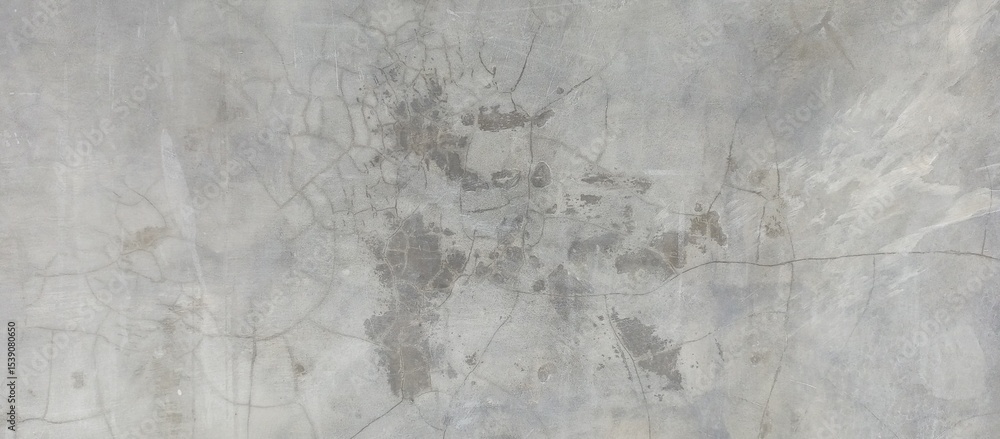 Naklejka premium Heavily Cracked and Stained Gray Concrete Wall
