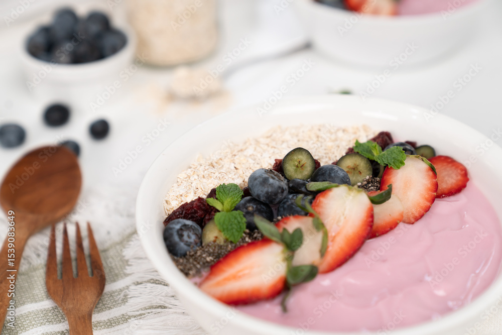 Presented by fruits putting yogurt toppings with strawberry, berry, oats, raisins and chia seed decorated by peppermint in white blow. Pink background. Set of healthy dairy product choice. Pecuniary. Presented by fruits putting yogurt toppings with strawberry, berry, oats, raisins and chia seed decorated by peppermint in white blow. Pink background. Set of healthy dairy product choice. Pecuniary.