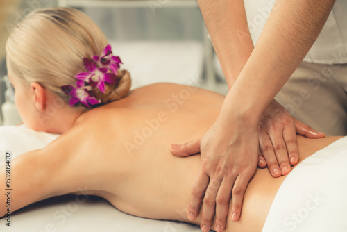 Wallpaper Mural Caucasian woman customer enjoying relaxing anti-stress spa massage and pampering with beauty skin recreation leisure in day light ambient salon spa at luxury resort or hotel. Quiescent Torontodigital.ca