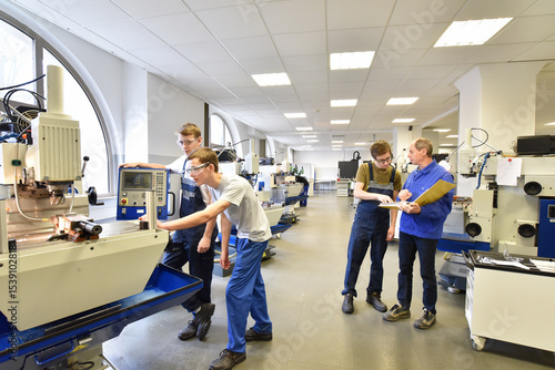 Group of young people in technical vocational training with teacher