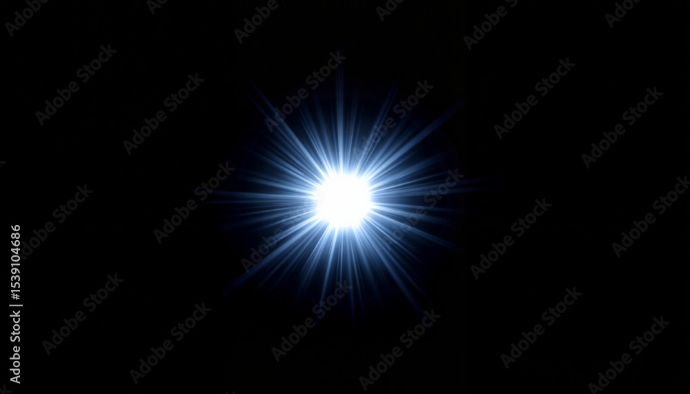 Obraz premium Bright blue starburst light on black background 