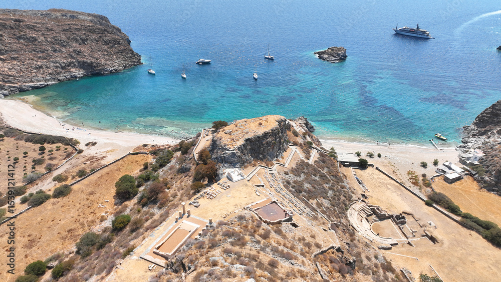 Obraz premium Aerial drone photo of archaeological seaside site of ancient Karthaia featuring Doric temple of Pythian Apollo, theatre and crystal clear beach of Polles in island of Kea, Aegean Sea, Cyclades, Greece