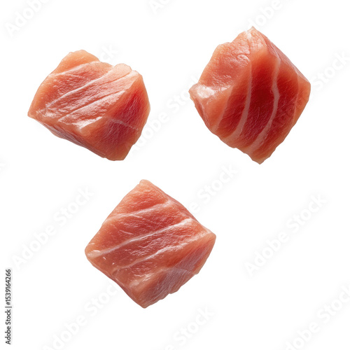 Fresh, high-quality sushi-grade tuna chunks ready for culinary preparation in a clean, modern kitchen setting. on transparent background