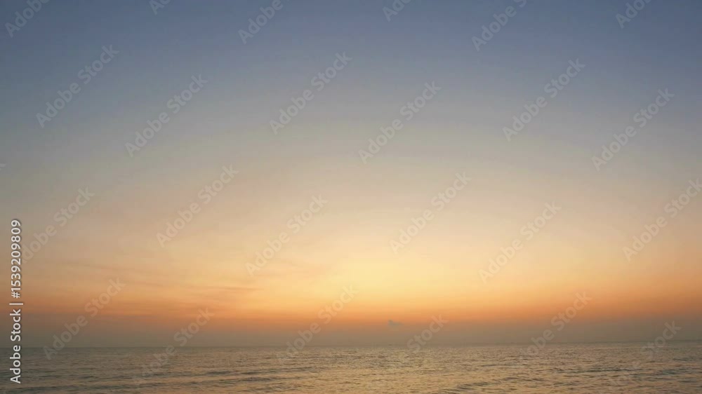 Serene Coastal Sunset: Blurry Horizon, Orange and Gold Hues Serene Coastal Sunset: Blurry Horizon, Orange and Gold Hues
