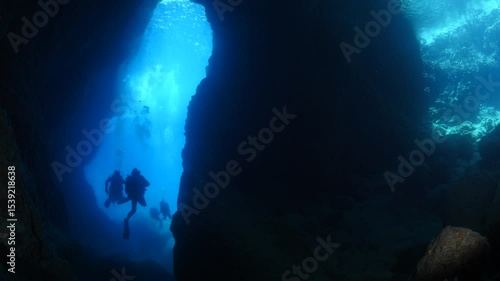 Wallpaper Mural scuba divers are exploring caves underwater Torontodigital.ca