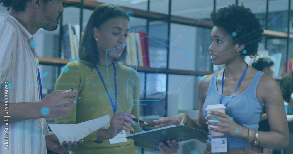 Obraz premium Collaborating colleagues pointing at tablet and reviewing documents in office with graphic overlays