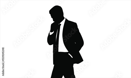 Silhouette of a businessman in a suit contemplating