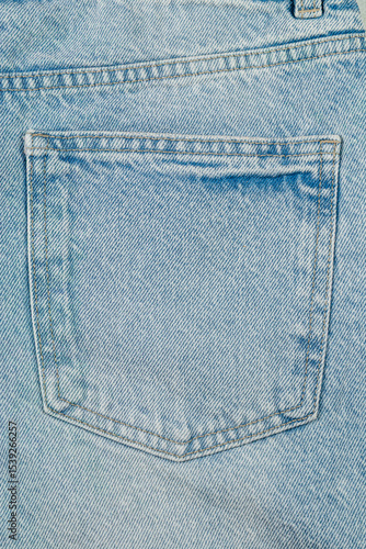 Vintage light blue denim pocket close-up with stitching details