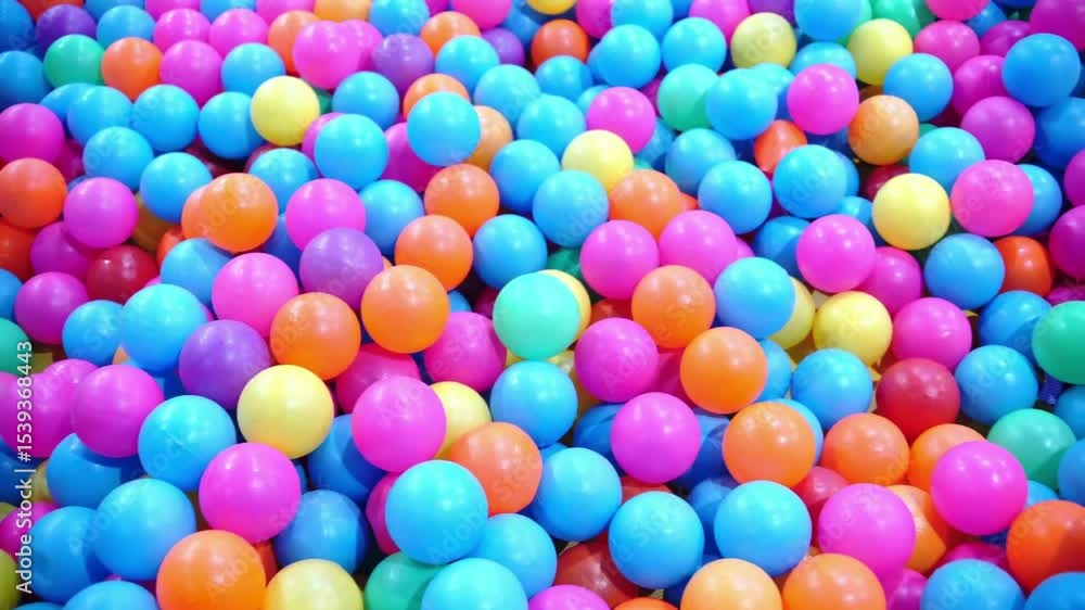 Close-up view of brightly colored candy balls in assorted shades, creating a playful and textured confectionery background Close-up view of brightly colored candy balls in assorted shades, creating a playful and textured confectionery background