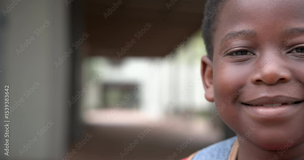 Smiling African American boy outdoors, enjoying bright day at school, copy space Smiling African American boy outdoors, enjoying bright day at school, copy space