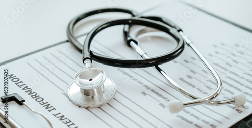 A stethoscope rests on a patient information form, symbolizing medical care, diagnosis, and healthcare documentation.
