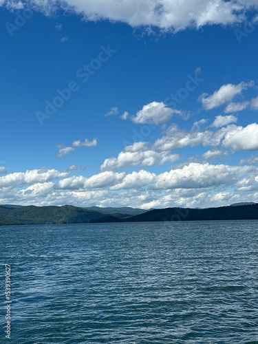 Clouds Over the Blue Lake with Mountains